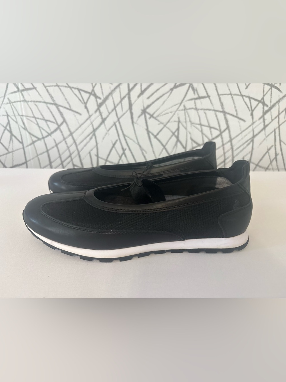 DKNY Frayne black Mary Jane sneaker blends a sporty mesh and faux-leather
